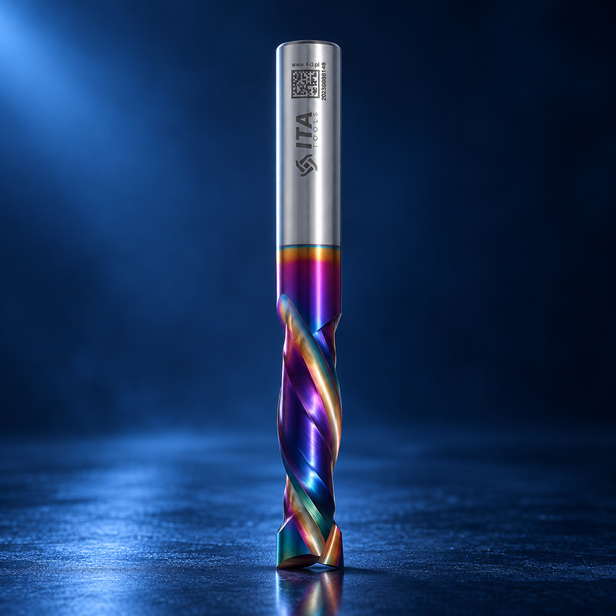 ITA Tools iridescent coated spiral end mill with polished steel shank on a blue studio background