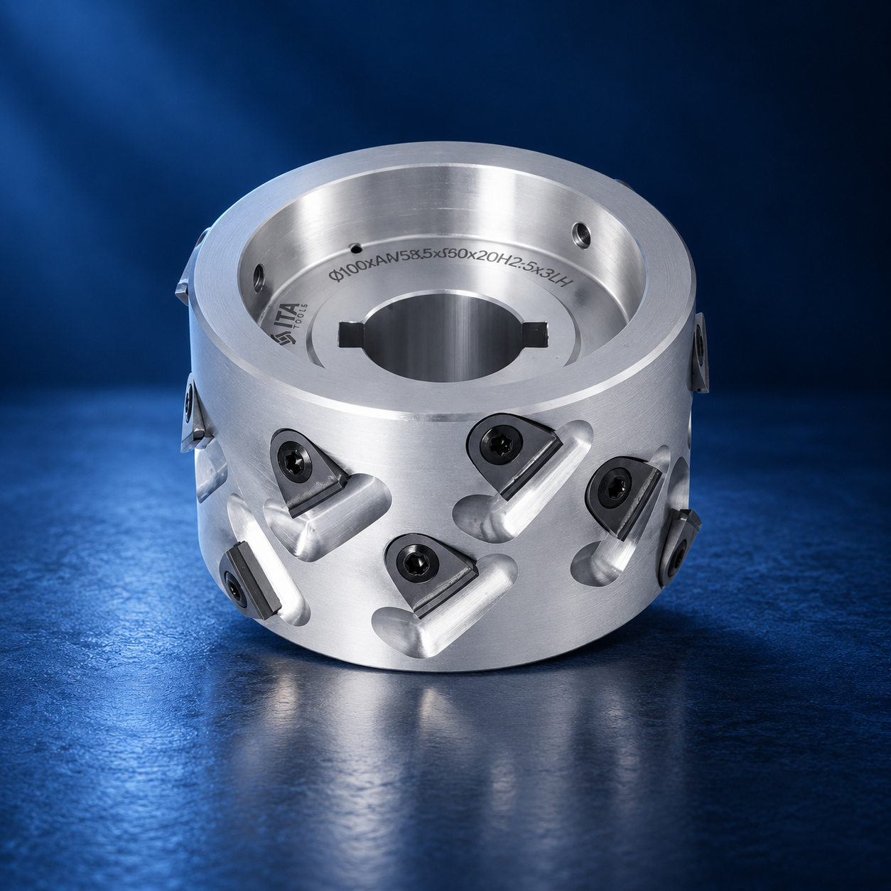 ITA Tools iridescent spiral compression router bit with polished steel shank on a blue studio background