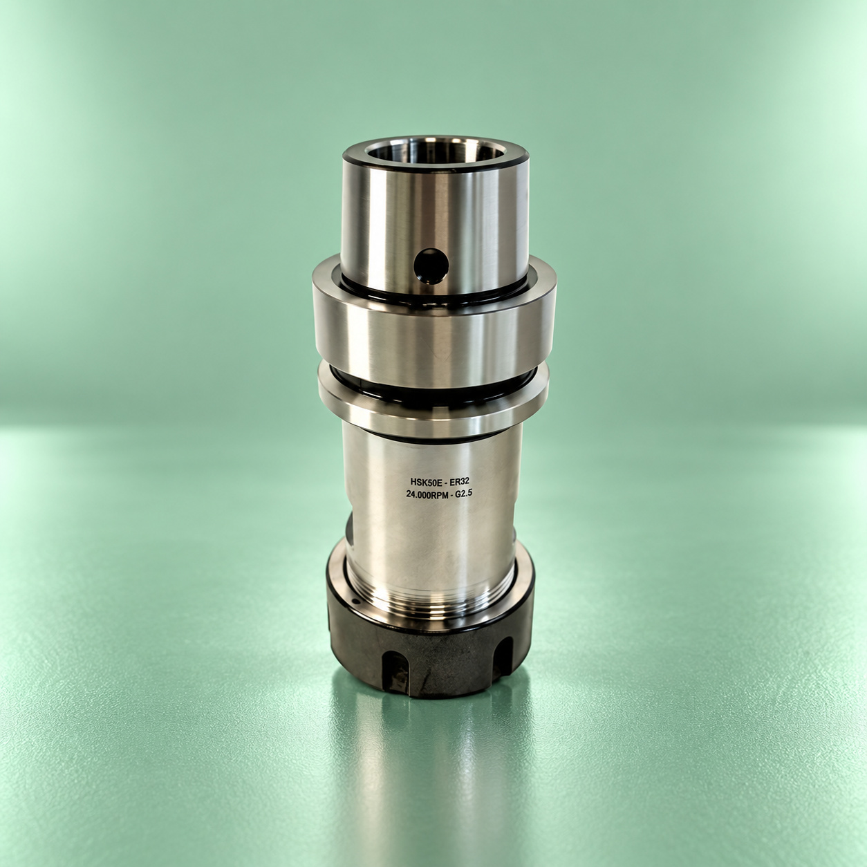 Klein Sistemi HSK-E ER32 precision collet chuck on a mint green reflective stage