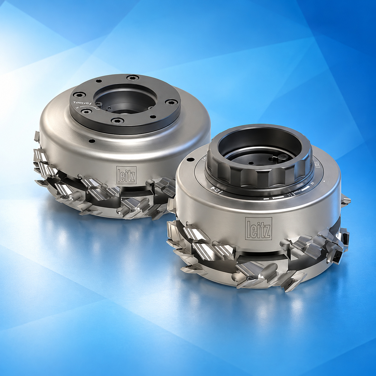 Pair of Leitz cutter heads on a blue reflective studio background