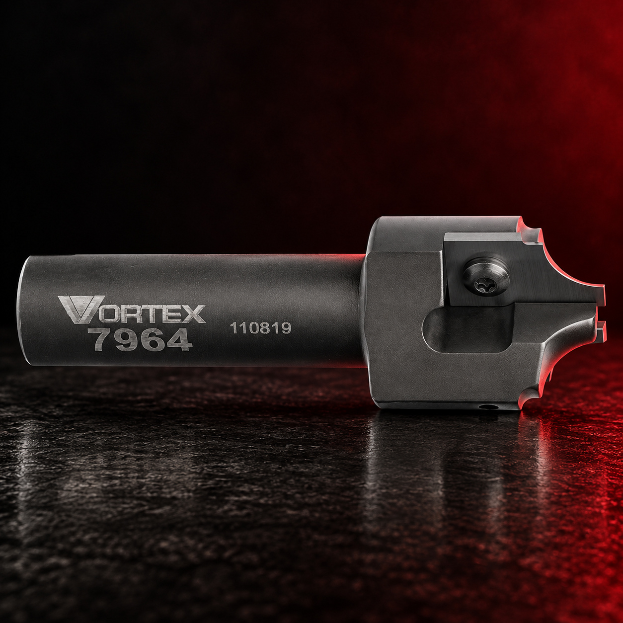Vortex Tool chamfer insert router bit on a black studio surface with red edge lighting